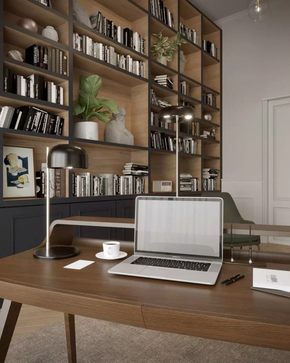Gabinet w stylu klasycznym z biblioteczką. Na biurku laptop. Kolory dominujące na zdjęciu to zielony, brązowy i czarny.