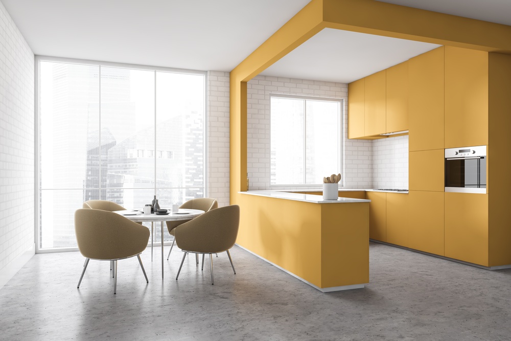 Kuchnia z jadalnią w stylu minimalistycznym w odcieniach koloru żółtego